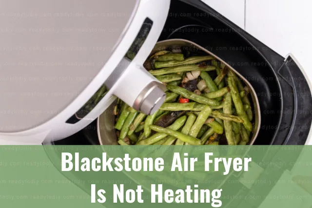 Modern air fryer in the kitchen with food inside