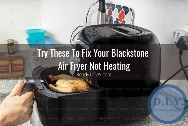 Modern air fryer in the kitchen with food inside