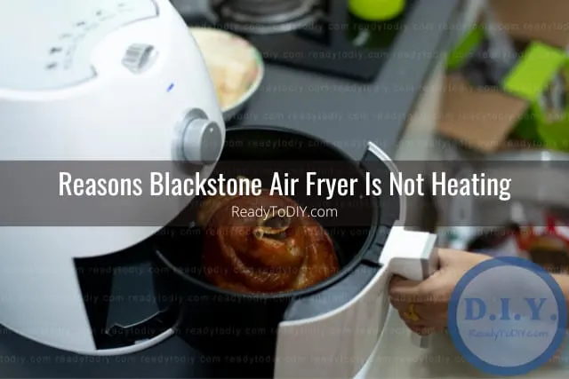Modern air fryer in the kitchen with food inside