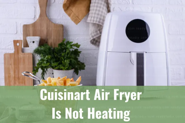 Modern air fryer in the kitchen with food inside