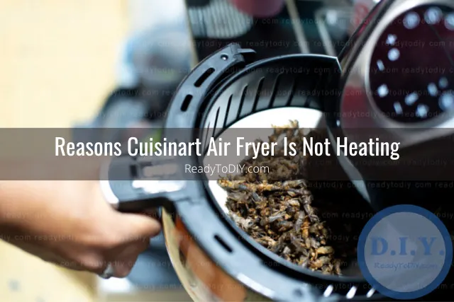 Modern air fryer in the kitchen with food inside