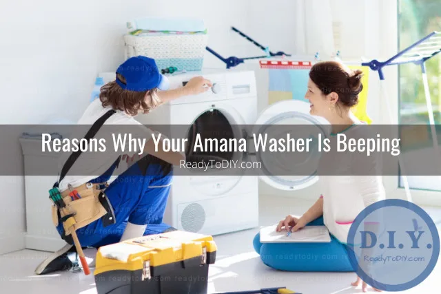 man fixing washer