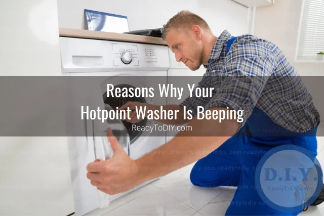 man fixing washer