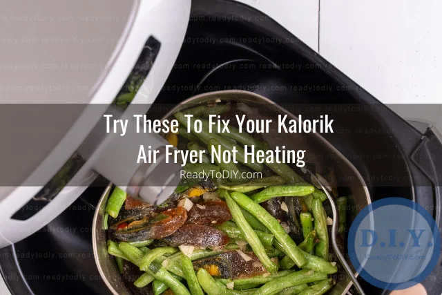 Modern air fryer in the kitchen with food inside
