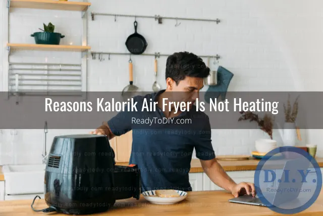 Modern air fryer in the kitchen with food inside
