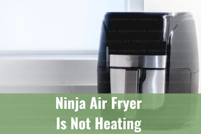 Modern air fryer in the kitchen with food inside