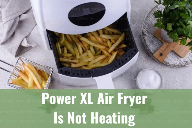 Modern air fryer in the kitchen with food inside