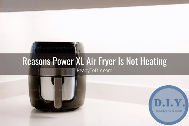 Modern air fryer in the kitchen with food inside