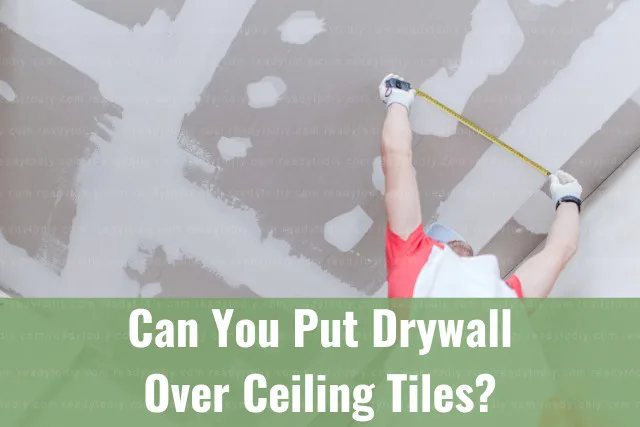 man worker fixing ceiling