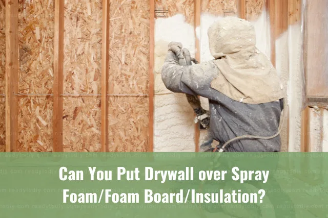 Man putting foam on the wall