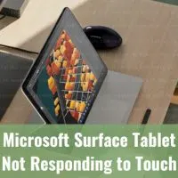 Black microsoft surface tablet on the table