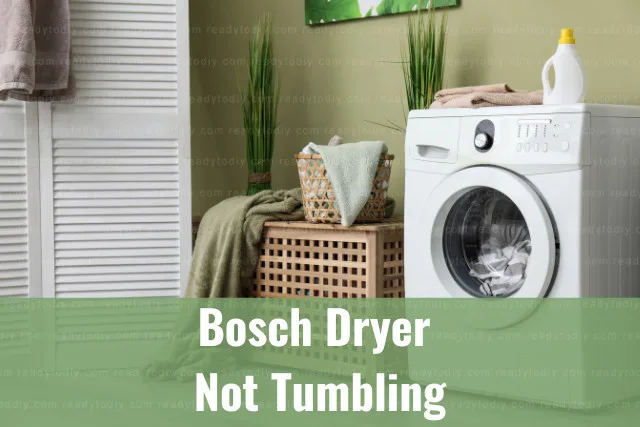 White dryer machine with clothes