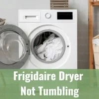 White dryer machine with clothes