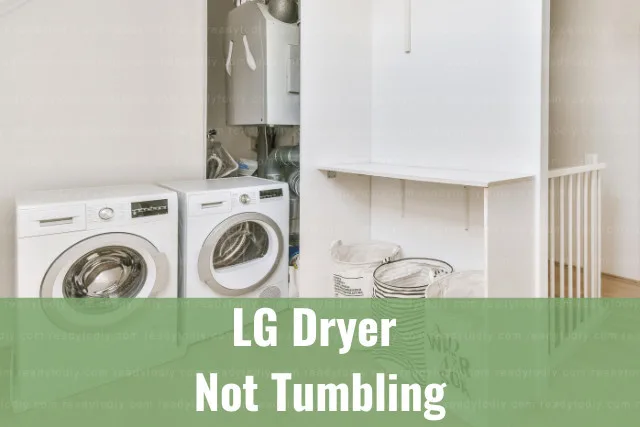 White dryer machine with clothes