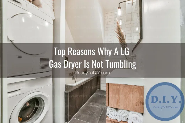 White dryer machine with clothes