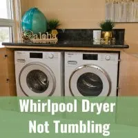 White dryer machine with clothes