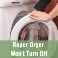 White modern dryer with clothes