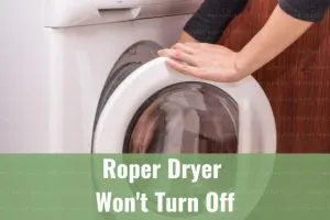 White modern dryer with clothes